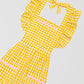 Yellow vichy checkered kitchen apron with ruffles and green details on pockets and skirt 
