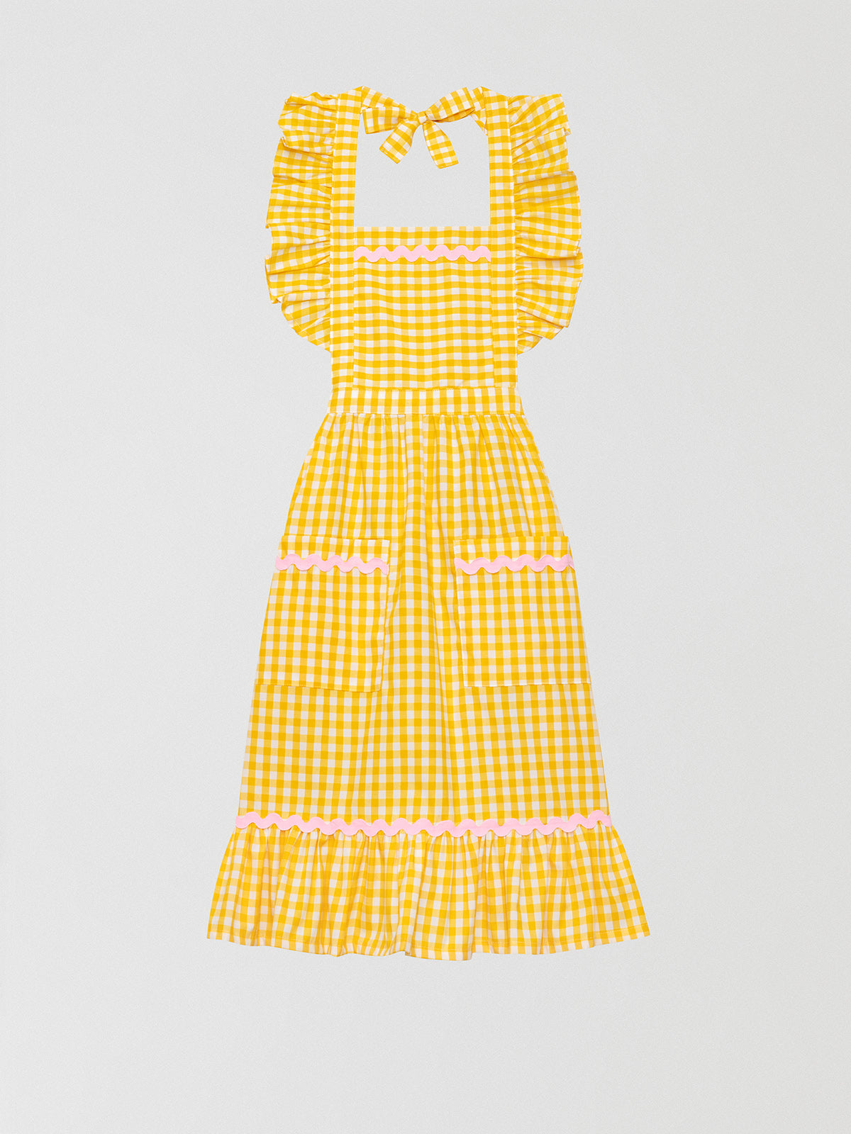Cocinitas Apron Yellow is a yellow vichy apron with baby pink trim details on the skirt and front pockets.