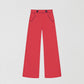 Red pique trousers with medium rise.