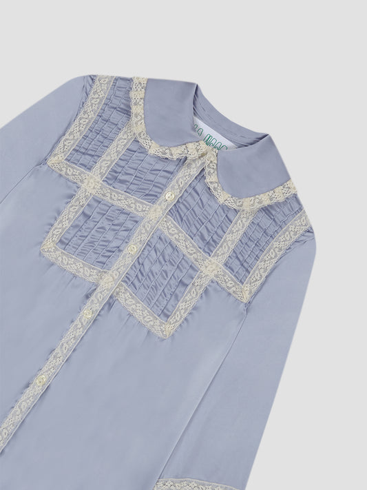 Lavender shirt with geometric lace pattern and pleated details.