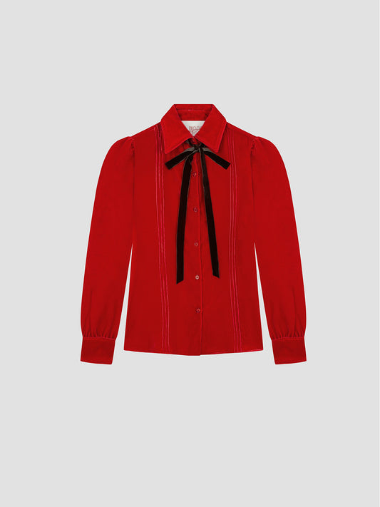 Red velvet shirt with brown bow on the collar