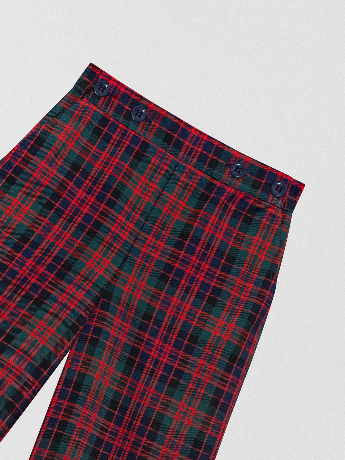Wool Bermuda shorts with check print in navy, green and red tones.