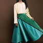 Flared midi skirt made in velvet with asymmetric pattern in blue and green. 