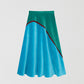 Flared midi skirt made in velvet with asymmetric pattern in blue and green. 