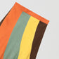 Flared linen midi skirt with asymmetric print in orange, yellow, green and brown.