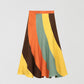 Flared linen midi skirt with asymmetric print in orange, yellow, green and brown.