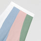Flared linen midi skirt with asymmetric print in baby pink, baby blue, green and white.