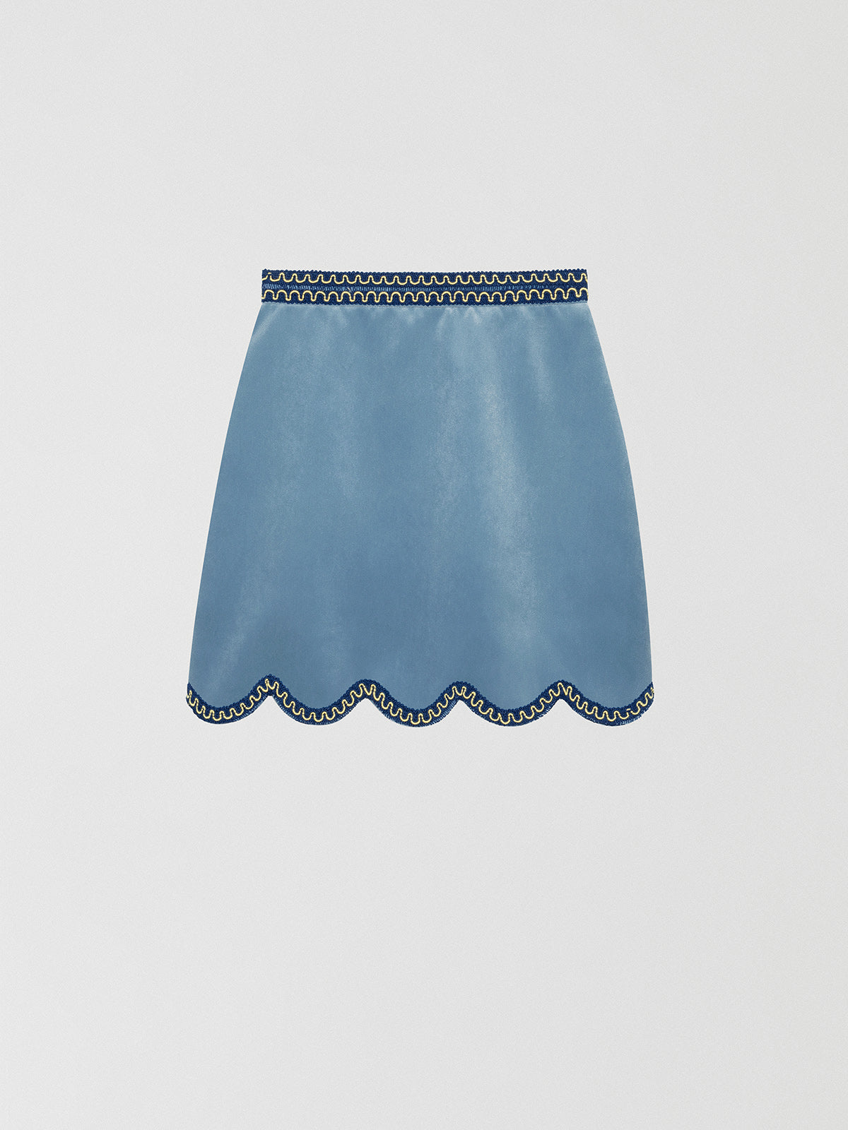Light blue mini skirt made of velvet with a wavy finish.