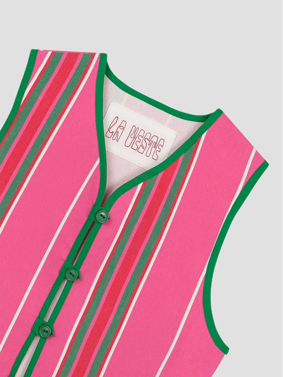 Fucshia cotton waistcoat with red and green stripes and green bias binding