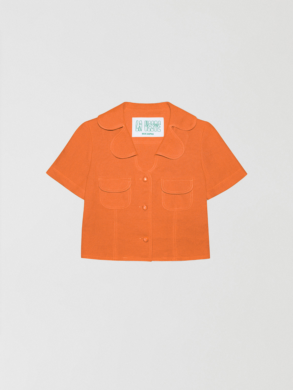 Loto Orange Shirt is a short sleeve shirt made of linen fabric, orange stitching and front buttons.