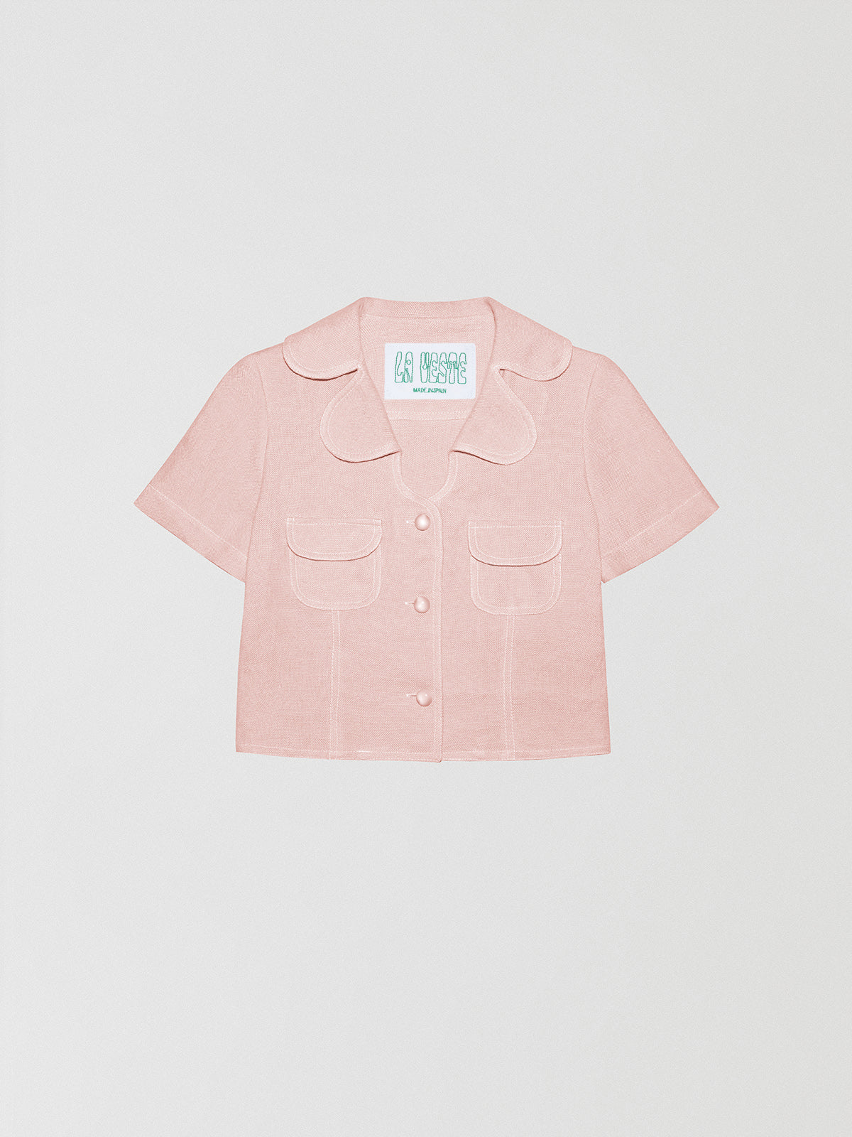 Loto Pink Shirt is a light pink linen shirt with front pockets and button closure in the same color.