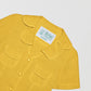 Women's yellow linen shirt with short sleeves and front pockets