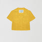 Loto Yellow Shirt is a short sleeve shirt with front buttons, two front pockets and color matched stitching.