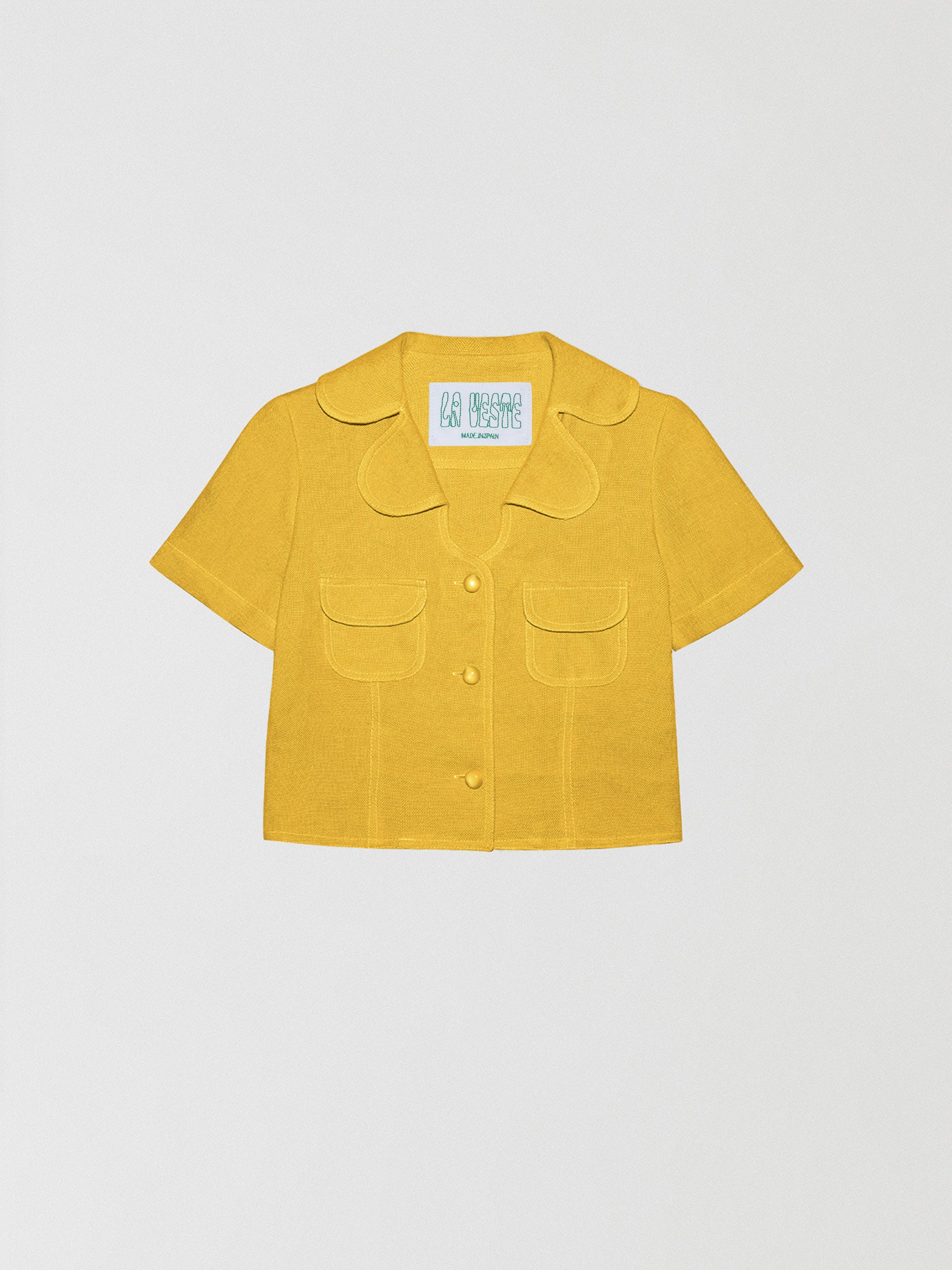 Loto Yellow Shirt is a short sleeve shirt with front buttons, two front pockets and color matched stitching.