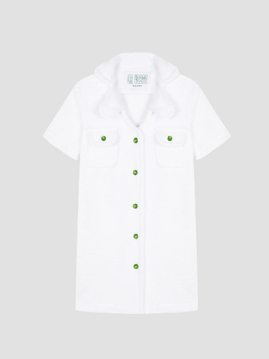 Loto Towel Dress White is a white towel dress with green buttons on the front.