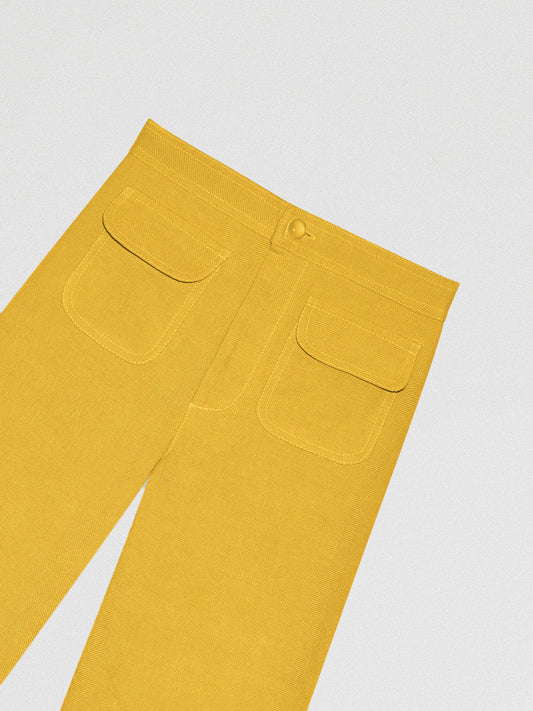 Yellow high-waisted linen trousers with pockets