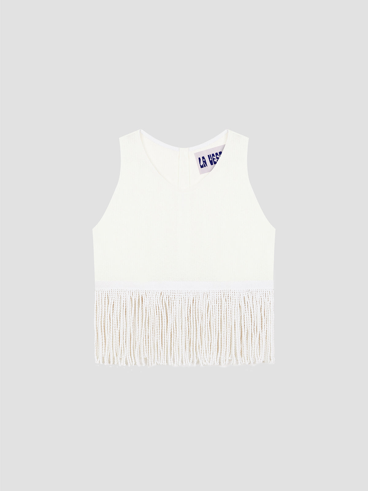 Top made in white cotton with white fringes.