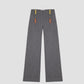 grey pants with colored button detail