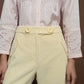 Baby yellow low rise corduroy trousers.