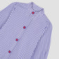 Women's long sleeve shirt with purple stripes and matching purple and red button closure.