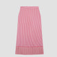 Miles Skirt Red is a pleated red and white striped midi skirt with pleats at the bottom.