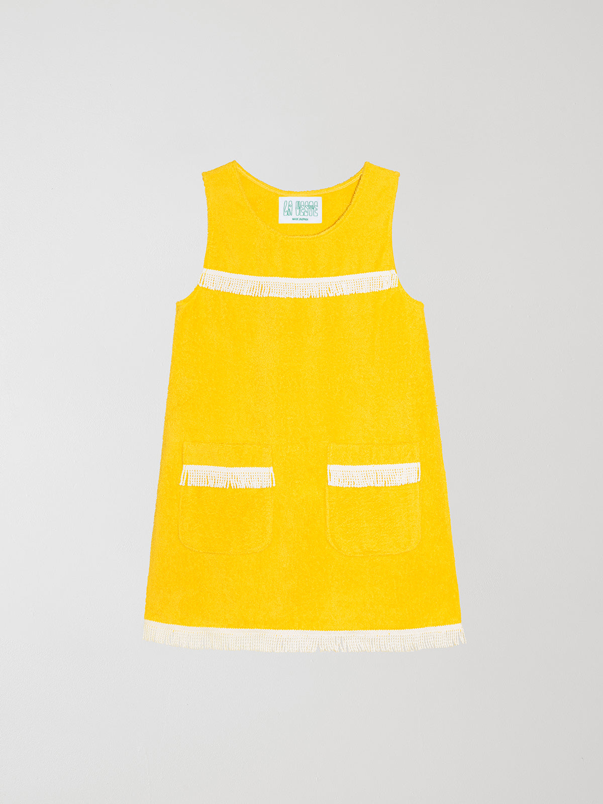 Fringes Mini Towel Yellow is a mini dress with bobbins, white bangs and round neck.