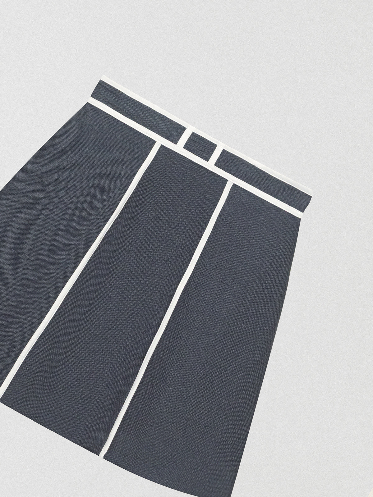 Flared linen grey mini skirt with white details.