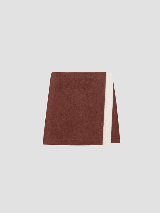 Colour: Brown/ Vanilla.  Mini pareo towel skirt made in brown cotton with vanilla towel band.  Regular fit.&nbsp; Short length Medium rise.&nbsp; Elasticated waist with velcro fastening.&nbsp; Vanilla stripe detail on the front.