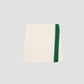 Colour: Vanilla / Green.  Mini pareo towel skirt made in vanilla cotton with green towel band.  Regular fit.&nbsp; Short length Medium rise.&nbsp; Elasticated waist with velcro fastening.&nbsp; Green stripe detail on the front.