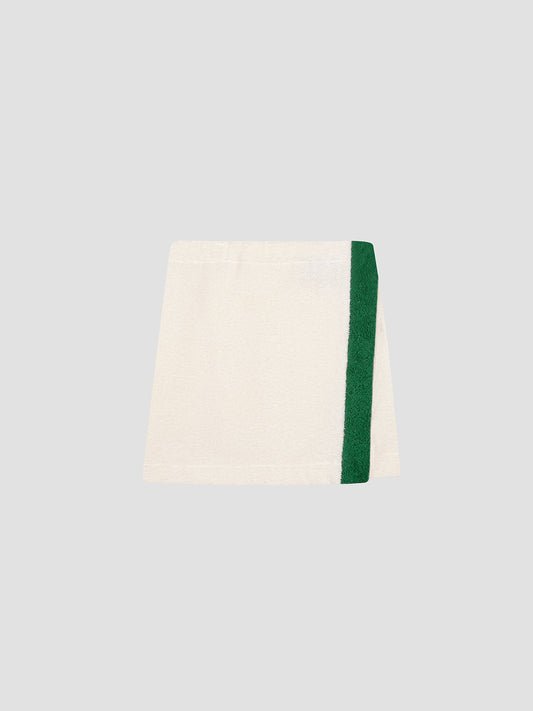 Colour: Vanilla / Green.  Mini pareo towel skirt made in vanilla cotton with green towel band.  Regular fit.&nbsp; Short length Medium rise.&nbsp; Elasticated waist with velcro fastening.&nbsp; Green stripe detail on the front.