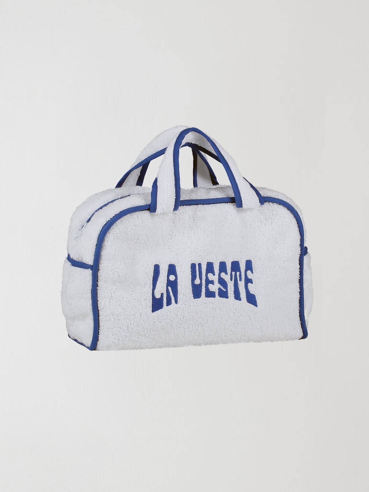 Mini Terry Towel Bag Blue is a white cotton towel bag with the La Veste logo in blue and blue details.