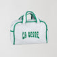 Mini Terry Towel Bag Green is a towel bag with zipper closure, green details and the La Veste logo in the same color.