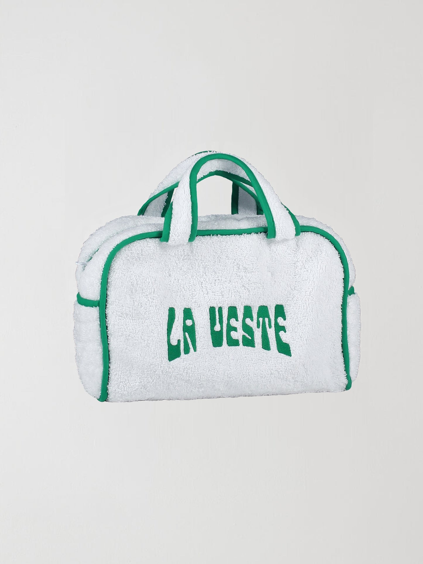 Mini Terry Towel Bag Green is a towel bag with zipper closure, green details and the La Veste logo in the same color.