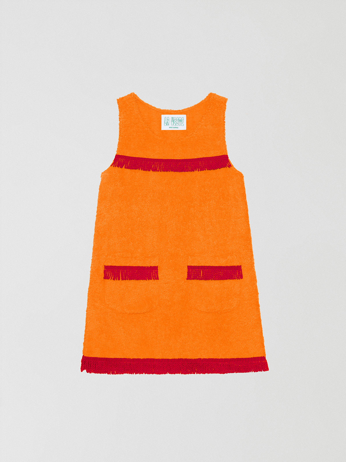 Fringes Mini Towel Orange is a short orange towel dress with red fringe detailing on the pockets and chest.