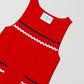 Short red dress with navy blue, pink and white piping details on front pockets and front pockets