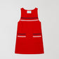 Mini Towel Red is a short sleeveless dress with blue, white and pink trim on the chest area and pockets.