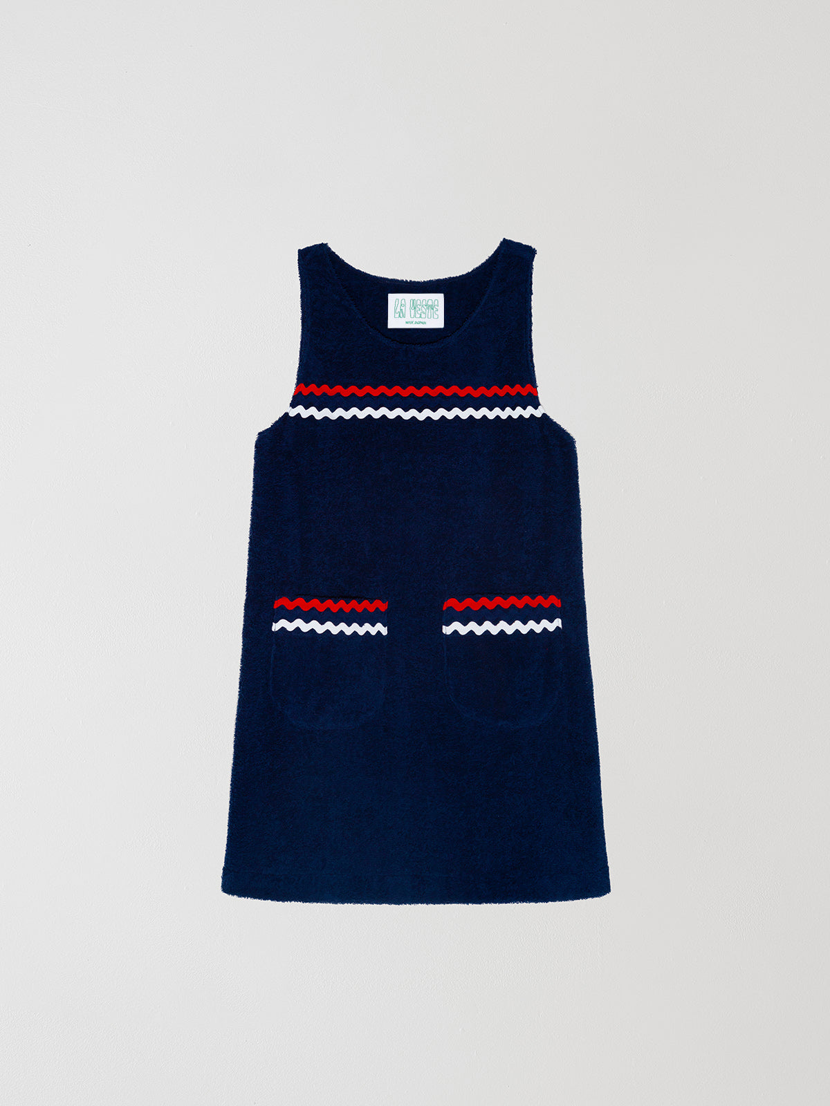 Mini Towel Blue is a navy blue dress with regular fit, round neck, pockets and fringe details.