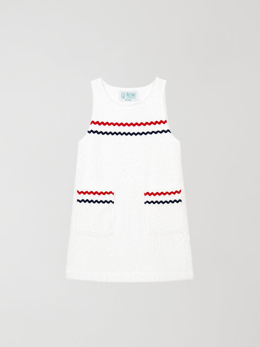 Mini Towel White is a white mini dress with blue and navy blue trim details on the front pockets and chest.