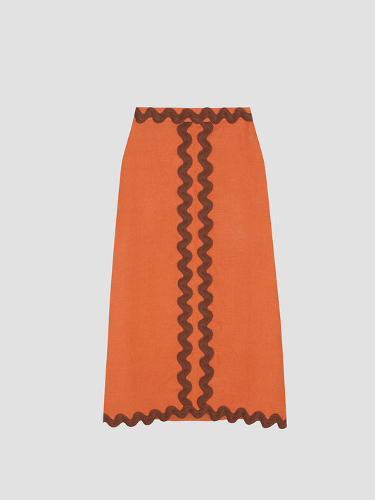 Midi skirt made in orange linen with brown trim detail