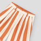 Cotton shorts with orange and ecru striped print. 