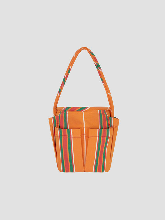 Round base bag in our iconic orange Pippi fabric. It features a medium short handle and external pockets. 