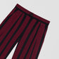 Burgundy and black striped suit trousers.