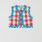 Red and white checked waistcoat made in cotton with blue trim detail on the edges