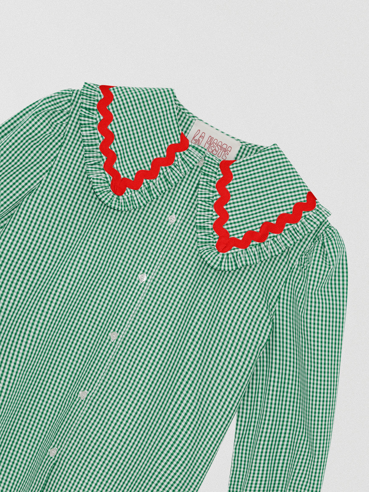 Green and white vichy check shirt made of cotton with red trim detail on the collar