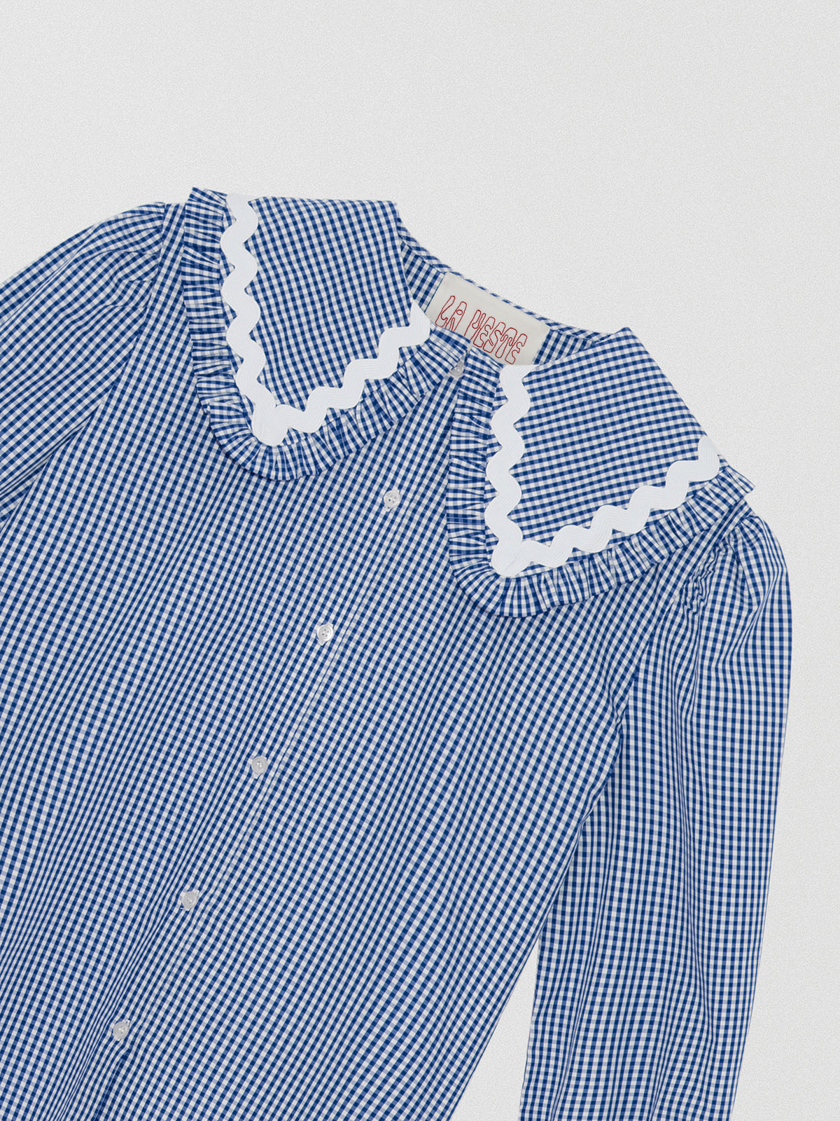 Navy and white vichy check shirt made of cotton with white trim detail on the collar