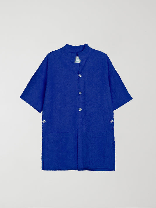 Ship Weel Blue is a long-sleeved kimono made of blue terry cloth with front pockets and V-neck.