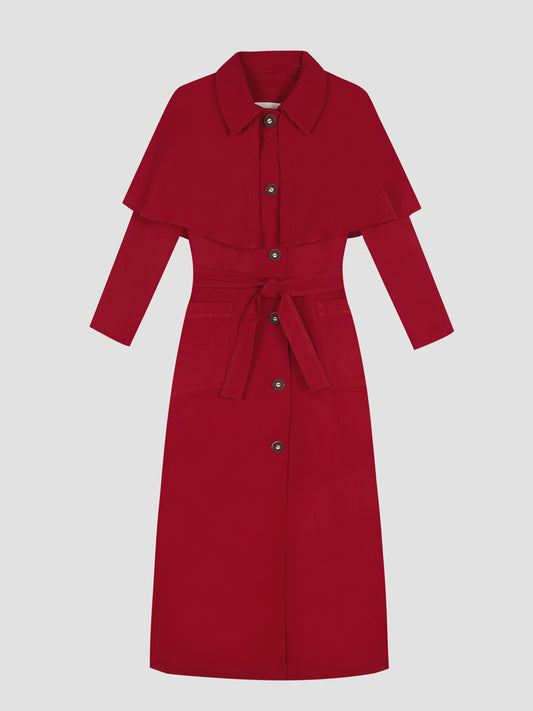 Sirimiri Trench Red is a mid-length red trench coat with red lined belt and flared skirt.
