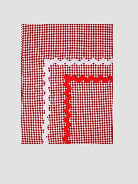 Tablecloth Mini Check Red is a rectangular red vichy check tablecloth with red and white piping details.