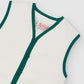 White cotton waistcoat with green bias binding