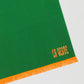 Towel made in green cotton with orange fringes detail. 